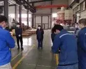 Employees gathered inside a workshop