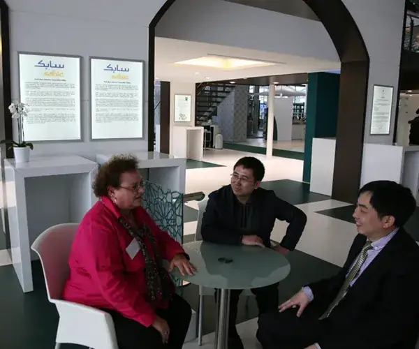 Visitors discussing products around a table