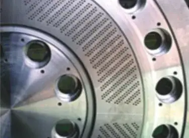 Close view of a die plate cutting face