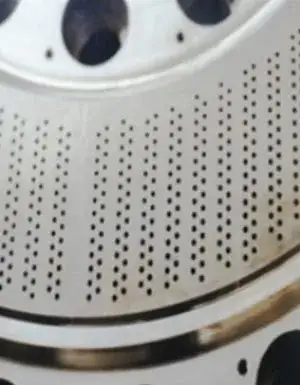 Close view of extrusion holes on a curved die face