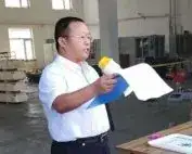 Man addressing employees with a megaphone
