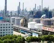 Petrochemical plant with towers and storage tanks