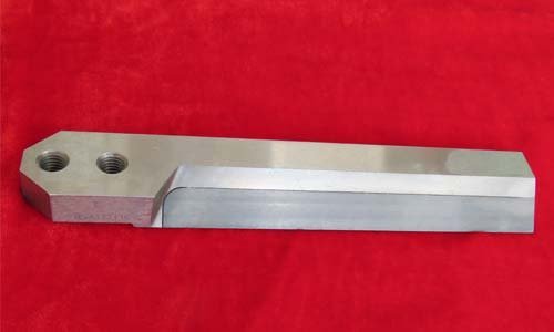 Pelletizing knife on red background